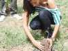 Kerrie Baylis plants fruit trees at Best Care Children's Home