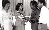 007 (500Wx315H) - The main cash prize: Miss Jamaica World 1981 Sandra Cunningham receiving a letter of commitment for the first prizes of $8,000 cash for the winner of this year's contest from Sales Manager of Gillette Caribbean Mr. Carlton A. Stephen. Gillette Caribbean L 